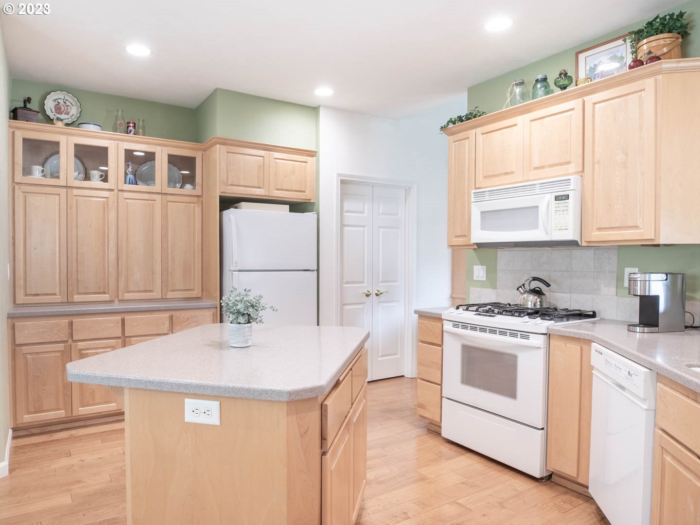 836 Old Orchard Lane Springfield, OR 97477 - Photo 9 of 29 a kitchen with stainless steel appliances granite countertop a stove a sink and a refrigerator