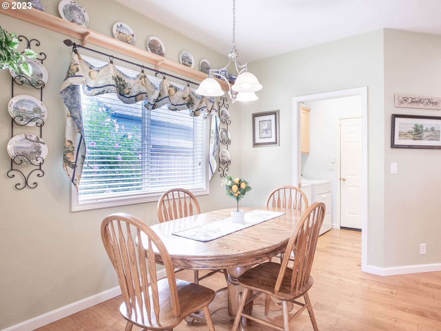 836 Old Orchard Lane Springfield, OR 97477 - Photo 10 of 29 a view of a dining room with furniture and chandelier
