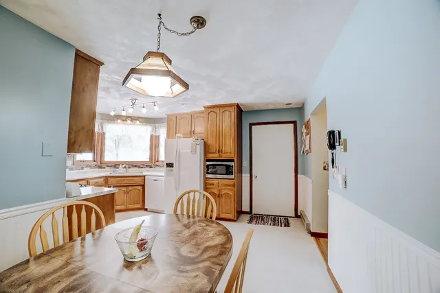 a view of a livingroom with furniture and workspace