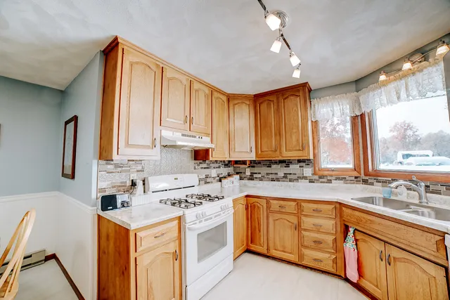 a view of a workspace with furniture and workspace