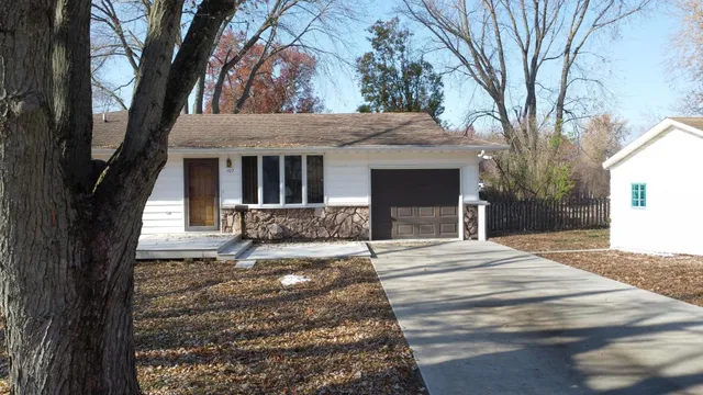 a bed room with a bed and a window