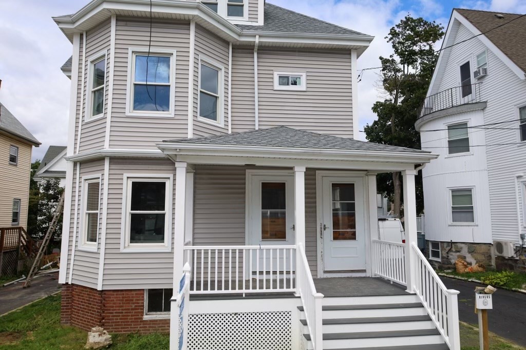 12 Magnolia Street, Unit 2 Malden, MA 02148 - Photo 1 of 1 a front view of a house with a porch