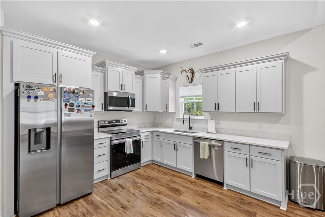 85 Cason Drive Pembroke, GA 31321 - Photo 5 of 14 Kitchen with gorgeous granite counter tops and SS appliances.