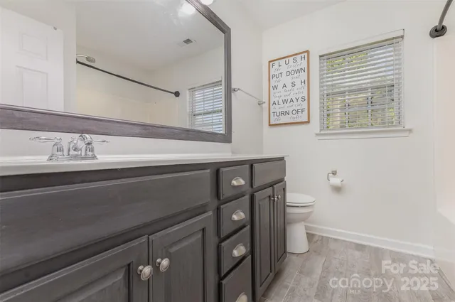 a view of bathroom with a sink and a toilet