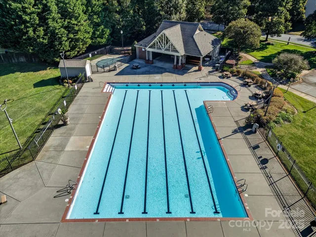 a view of swimming pool with a patio