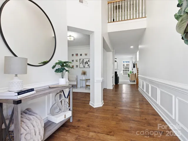 a view of a living room and entryway