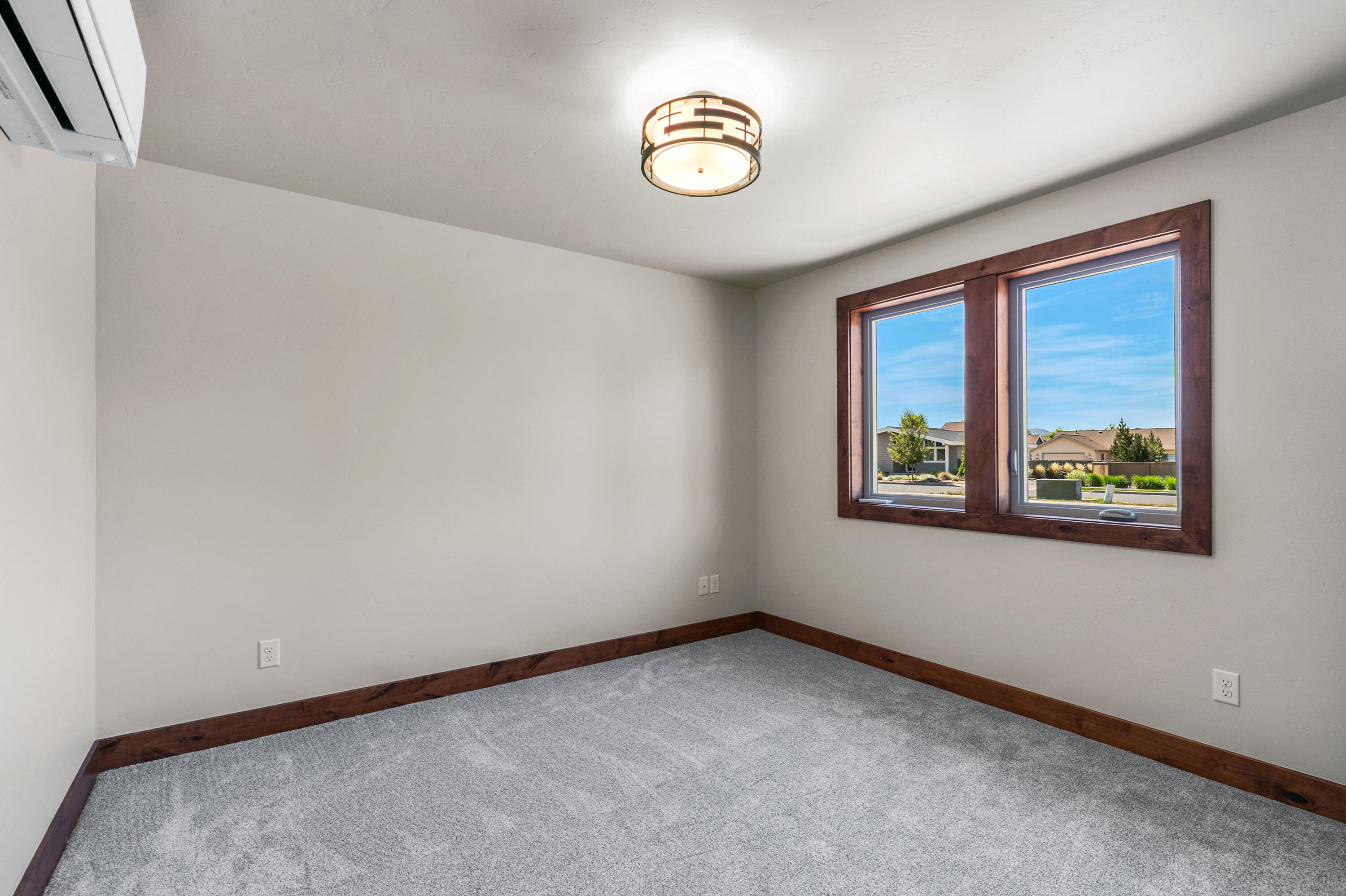 1472 Northeast Hudspeth Road Prineville, OR 97754 - Photo 21 of 26 an empty room with windows