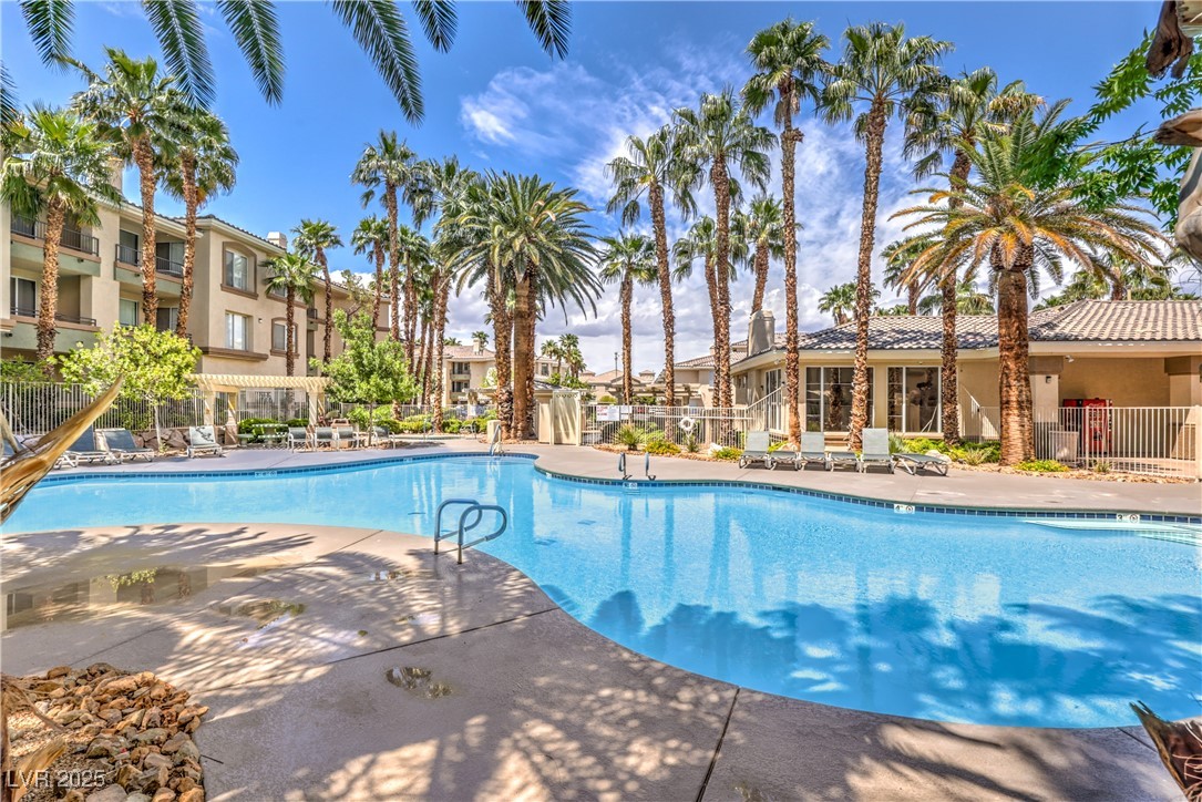 7119 South Durango Drive, Unit 207 Las Vegas, NV 89113 - Photo 2 of 35 Community pool with a patio area