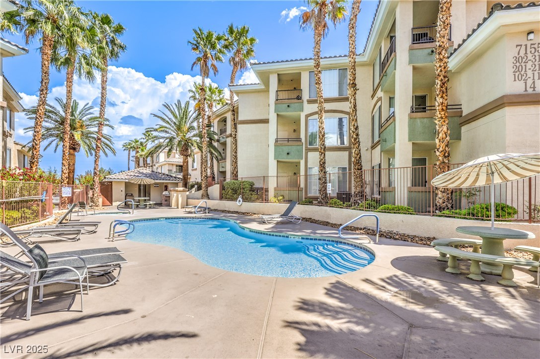 7119 South Durango Drive, Unit 207 Las Vegas, NV 89113 - Photo 3 of 35 Community pool featuring a patio