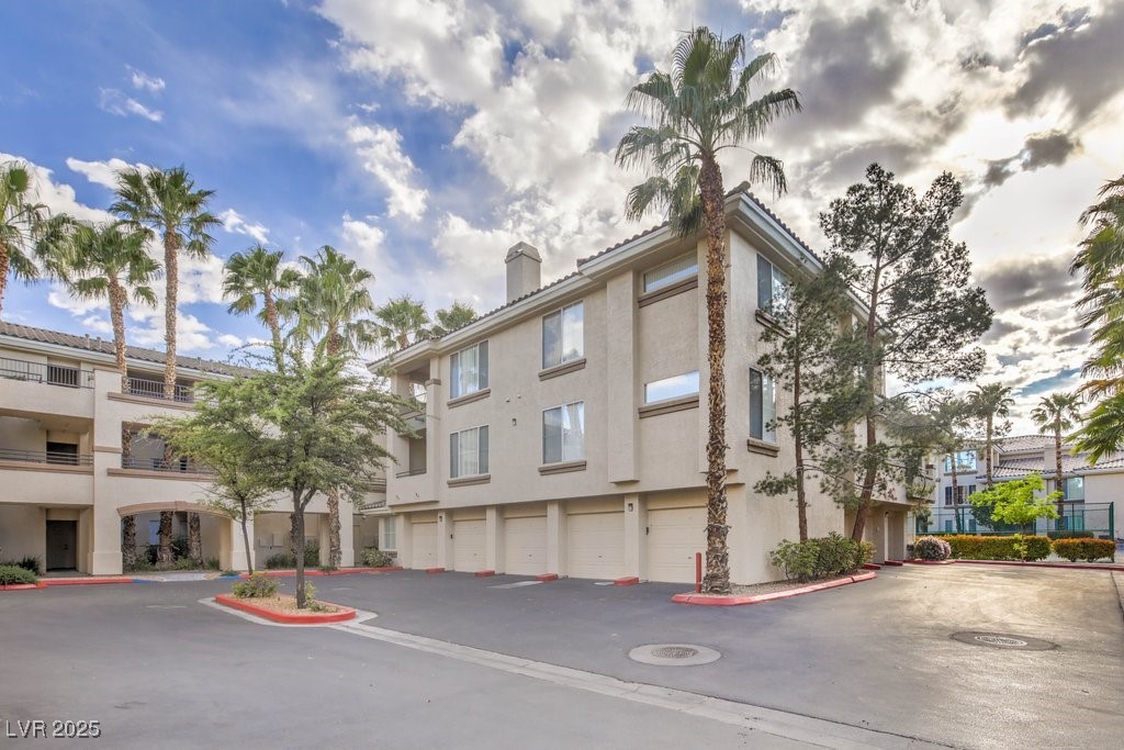 7119 South Durango Drive, Unit 207 Las Vegas, NV 89113 - Photo 5 of 35 View of property featuring community garages