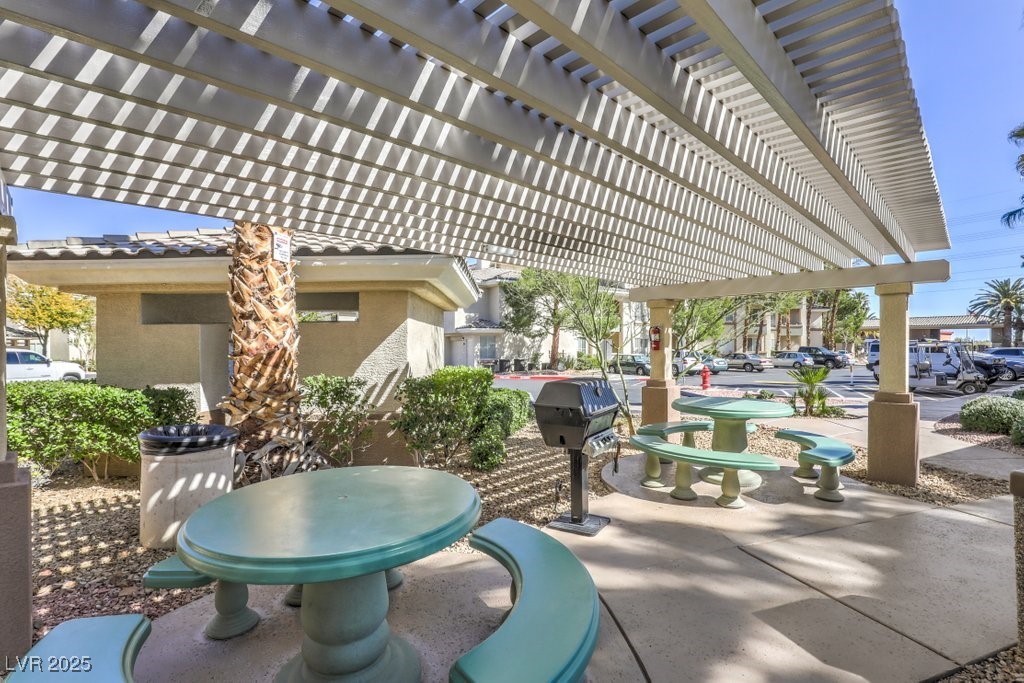 7119 South Durango Drive, Unit 207 Las Vegas, NV 89113 - Photo 7 of 35 View of patio with a pergola and area for grilling
