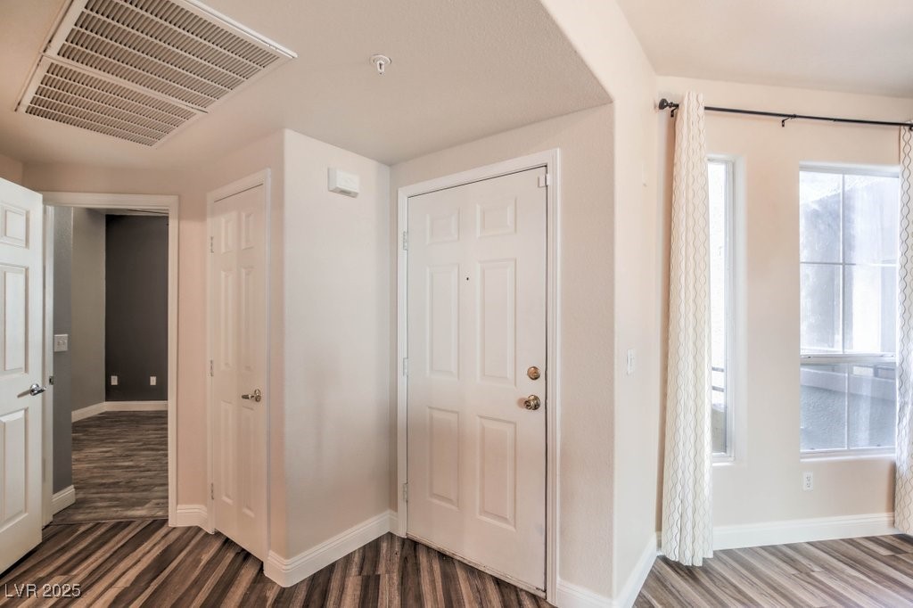 7119 South Durango Drive, Unit 207 Las Vegas, NV 89113 - Photo 10 of 35 Foyer entrance with dark wood finished floors