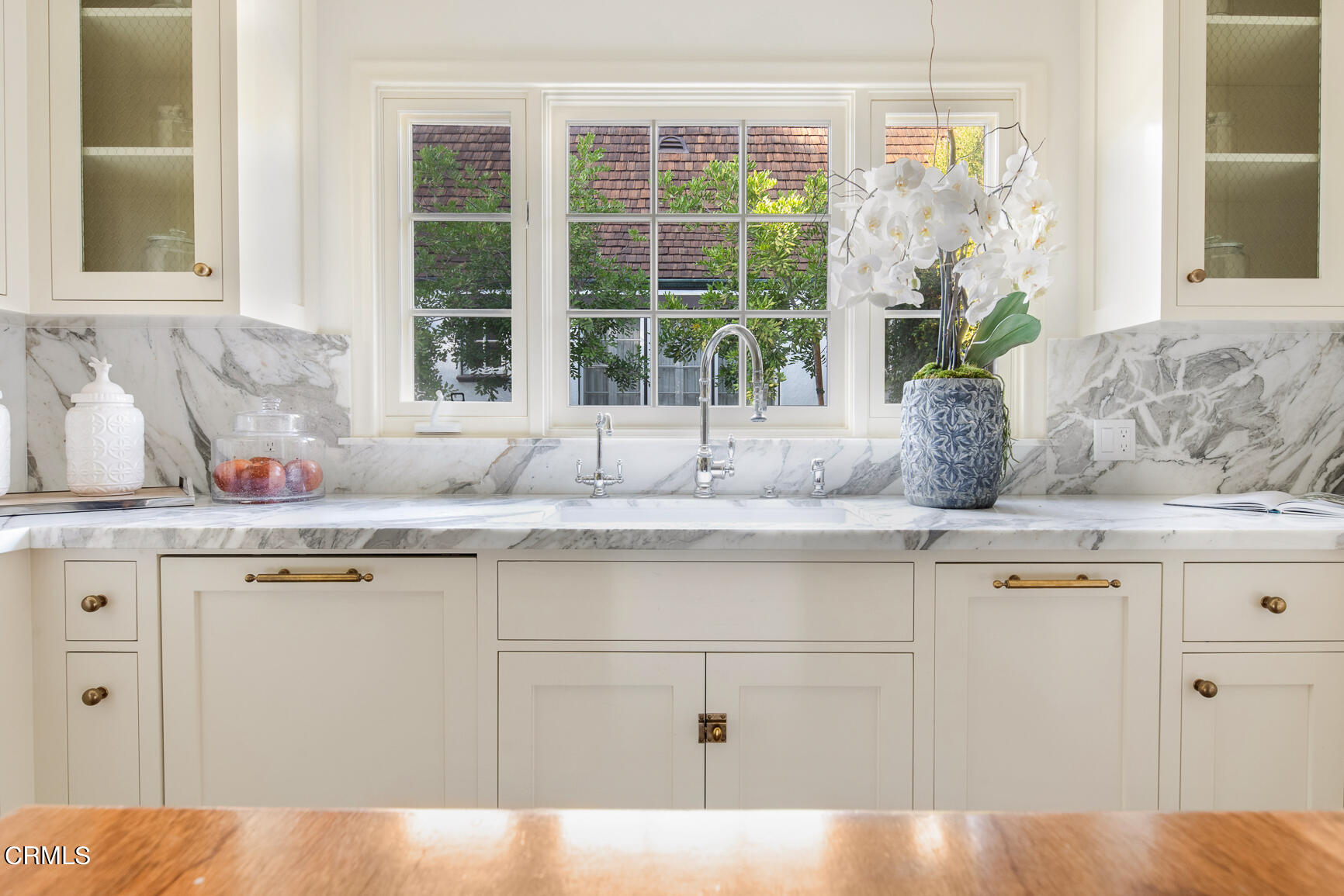 735 Holladay Road Pasadena, CA 91106 - Photo 16 of 72 a kitchen with stainless steel appliances granite countertop white cabinets and a large window