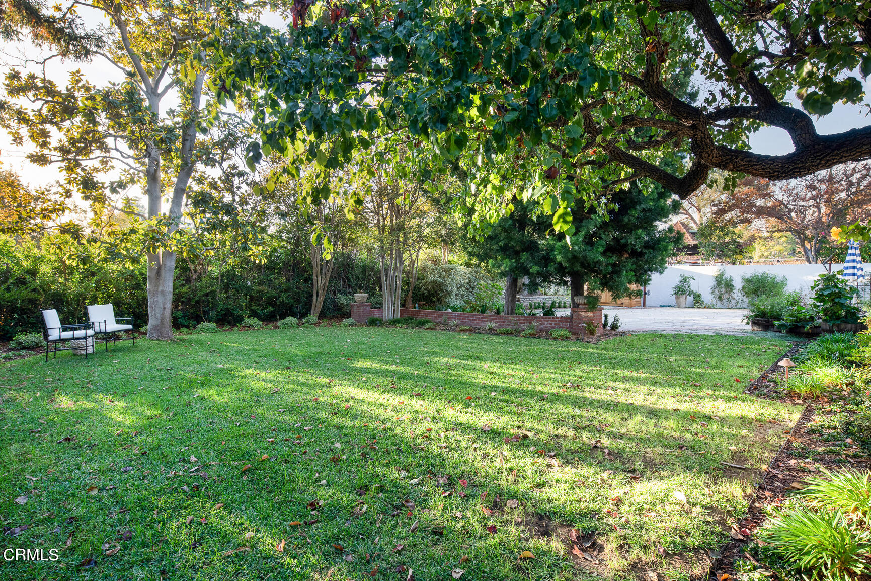 735 Holladay Road Pasadena, CA 91106 - Photo 63 of 72 a view of a yard with a house in the background