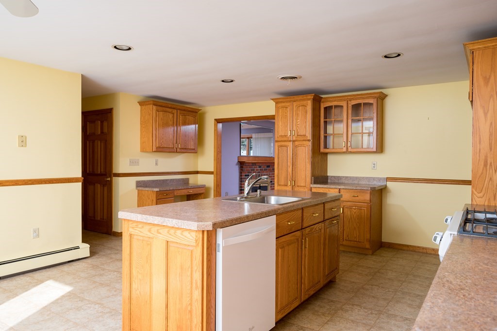 31 Andersen Road Braintree, MA 02184 - Photo 11 of 36 a kitchen with stainless steel appliances granite countertop a sink stove and refrigerator