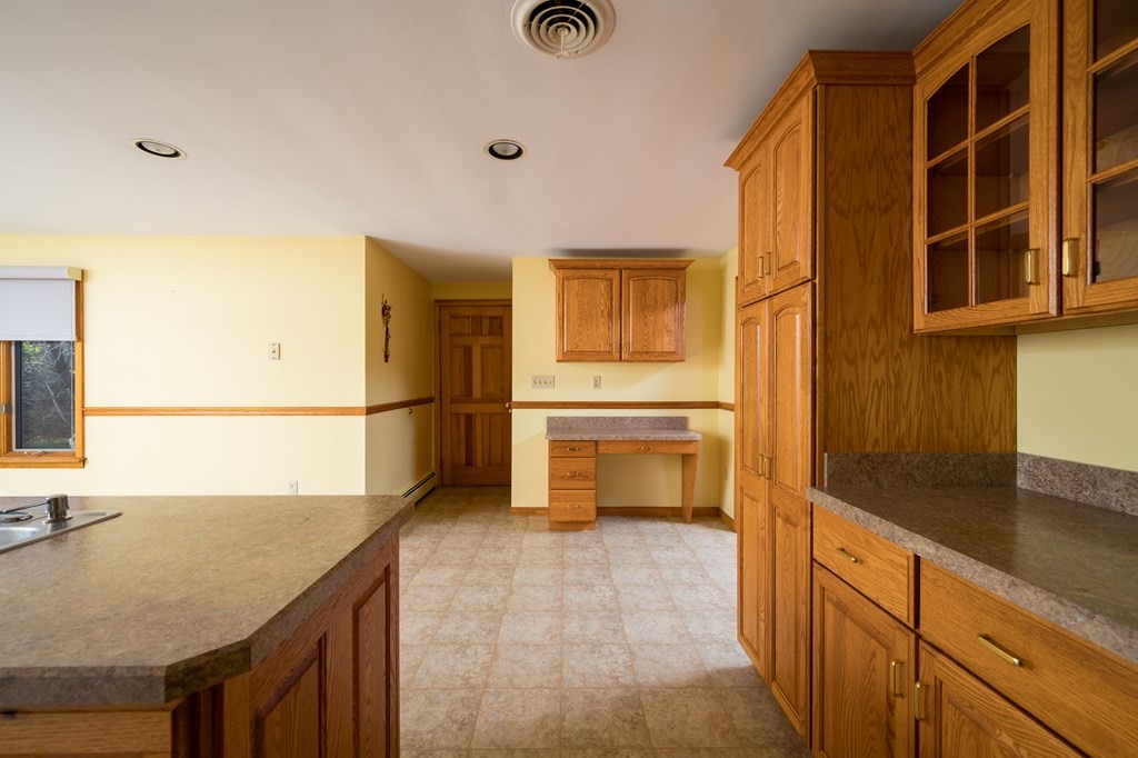31 Andersen Road Braintree, MA 02184 - Photo 13 of 36 a kitchen with stainless steel appliances granite countertop a sink and cabinets