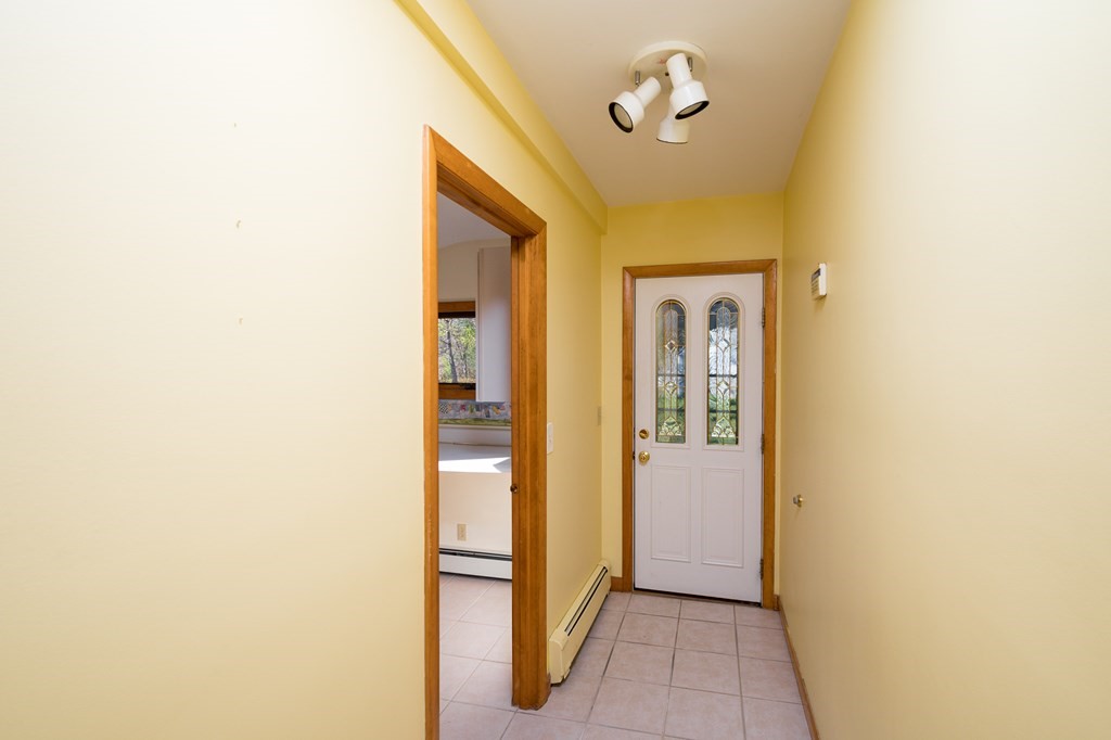 31 Andersen Road Braintree, MA 02184 - Photo 16 of 36 a view of a hallway with wooden floor