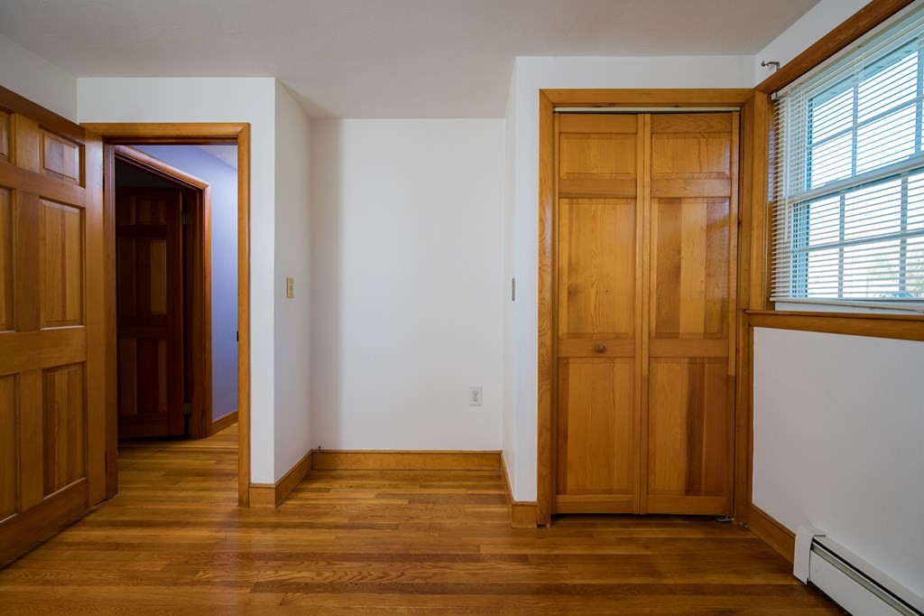 31 Andersen Road Braintree, MA 02184 - Photo 21 of 36 an empty room with wooden floor and windows