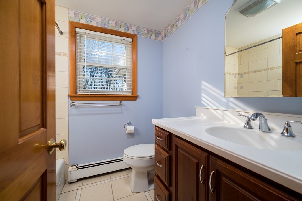 31 Andersen Road Braintree, MA 02184 - Photo 24 of 36 a bathroom with a sink a toilet and a window