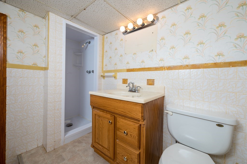 31 Andersen Road Braintree, MA 02184 - Photo 28 of 36 a bathroom with a sink a toilet and shower