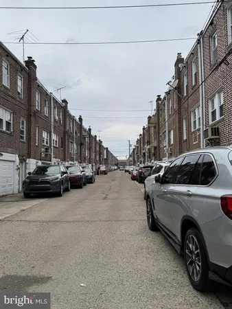a view of a street with cars