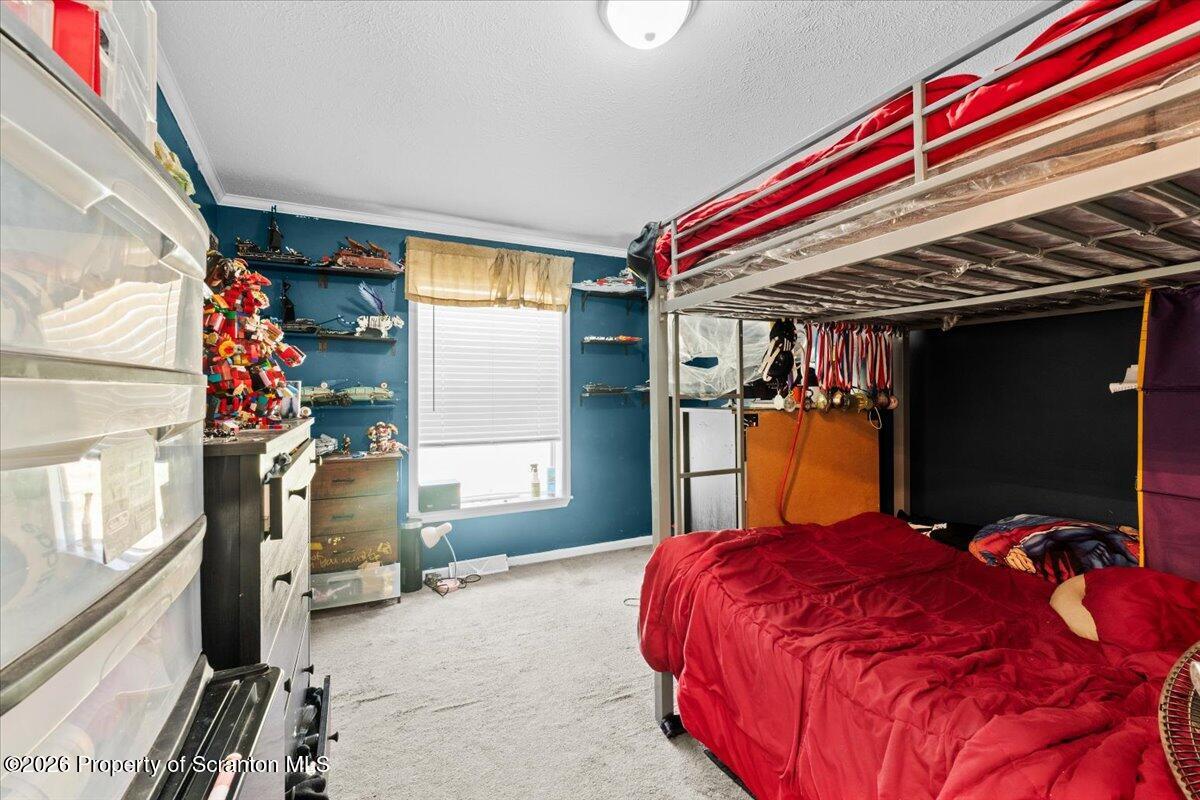 396 Park Road Dingmans Ferry, PA 18328 - Photo 24 of 39 a bed sitting in a bedroom next to a window
