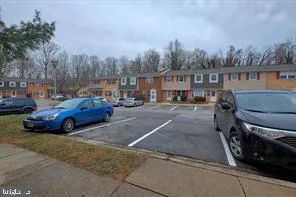 a view of street with parked cars