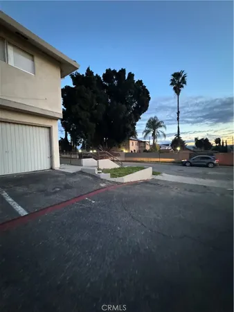 a view of a street in front of a house