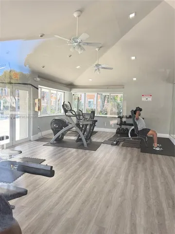 a kitchen with stainless steel appliances granite countertop a refrigerator sink and stove