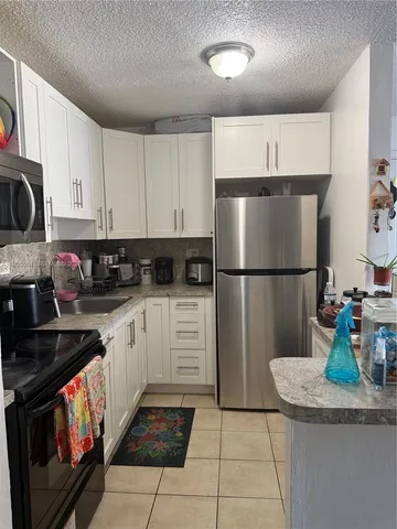 a room with a stove and a window