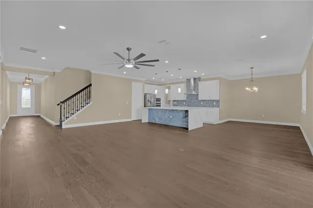 a spacious bathroom with a double vanity sink a mirror and a bathtub
