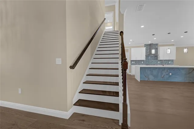 a bathroom with a sink a vanity and a large mirror