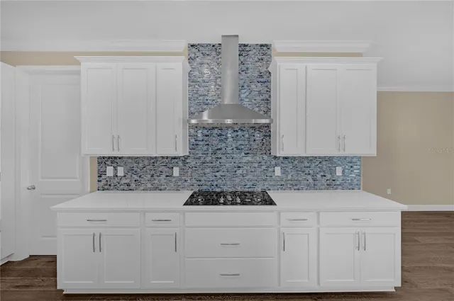 an open space with kitchen view and a window