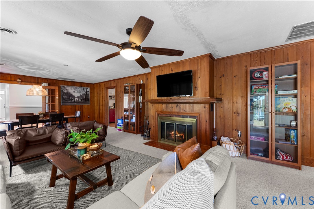 437 Plainview Road Kinsale, VA 22488 - Photo 35 of 63 a living room with furniture a fireplace and a flat screen tv