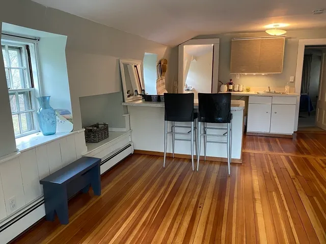a view of kitchen with sink and microwave