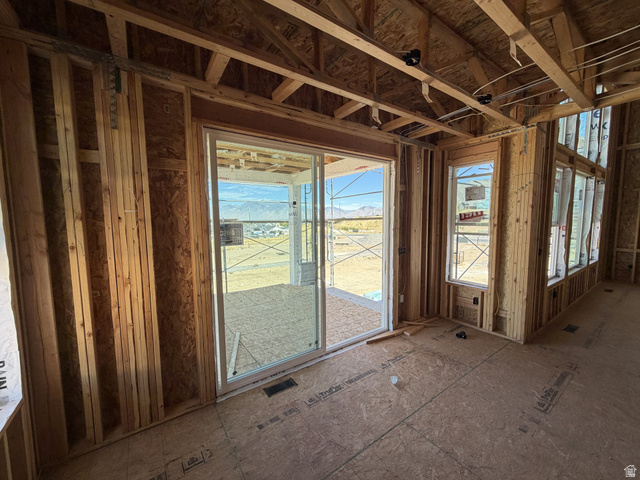 17 South Carson Way Salem, UT 84653 - Photo 5 of 14 Sliding glass door to an outdoor area, multiple windows, exposed wood framing, and plywood subflooring