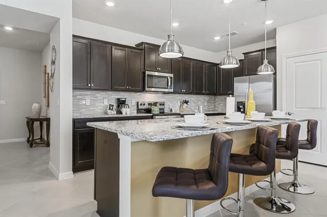 a kitchen with a sink cabinets and window