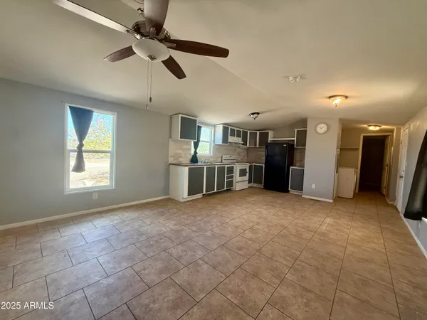 a view of a kitchen with a stove cabinets and a kitchen