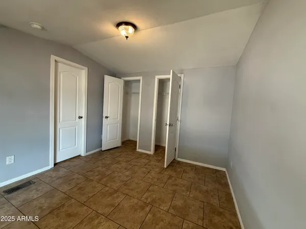 an empty room with closet