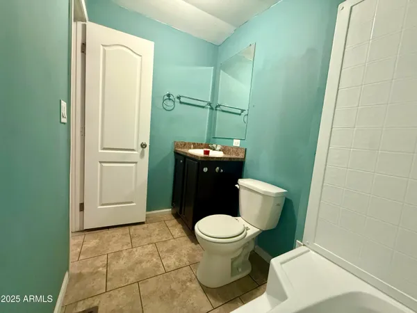 a bathroom with a toilet and a sink