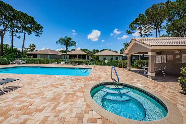 a view of a swimming pool with a patio