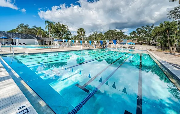 a view of swimming pool with a patio
