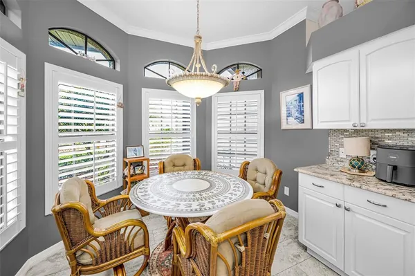 a dining room with furniture and window