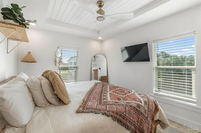 a white bath tub sitting next to a white toilet