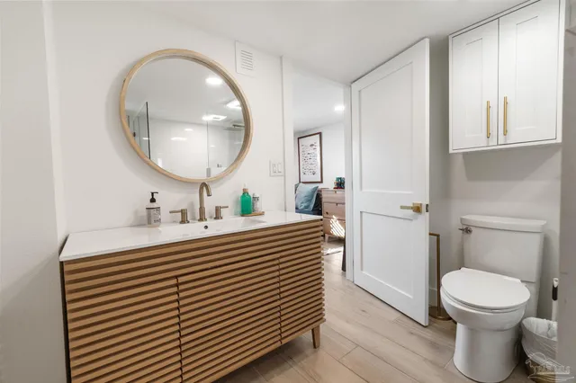 a view of staircase with railing and white walls