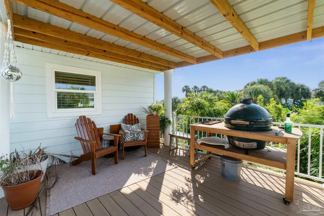 an aerial view of a house with a garden and swimming pool