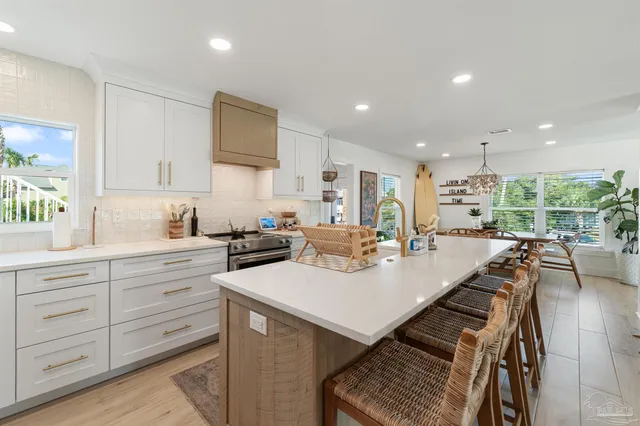 a kitchen with lots of counter top space and stove