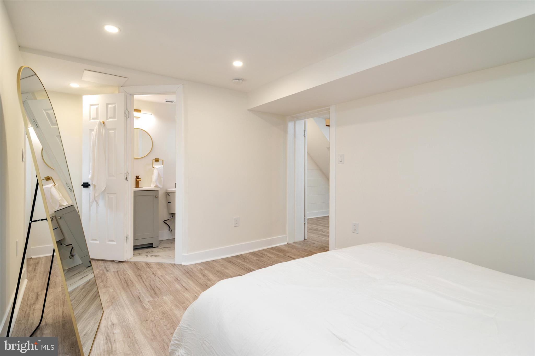 36 East George Street Westminster, MD 21157 - Photo 29 of 33 a bedroom with a bed and a large mirror