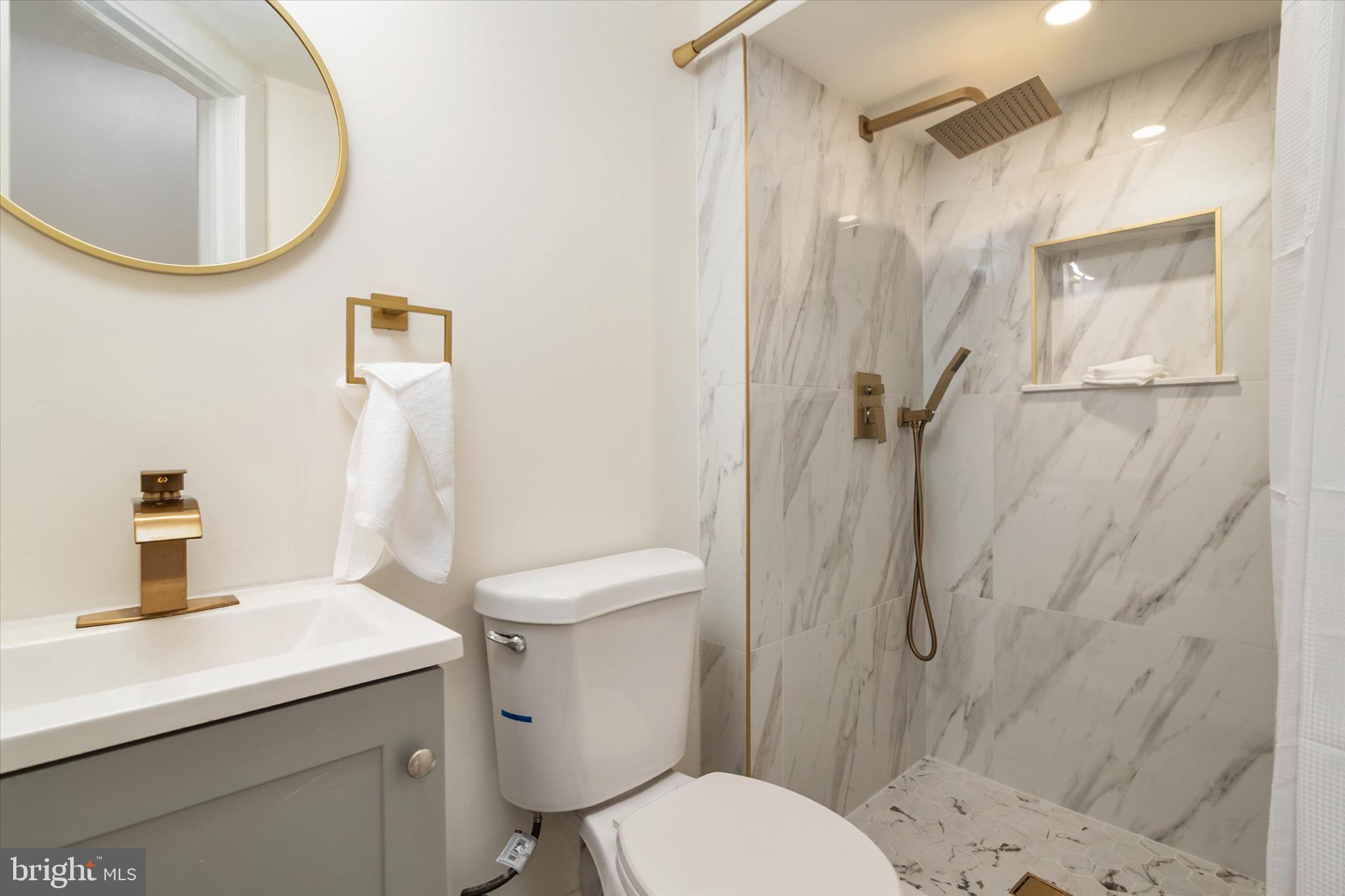 36 East George Street Westminster, MD 21157 - Photo 30 of 33 a bathroom with a sink toilet and shower