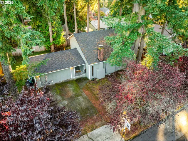 an aerial view of a house with pool